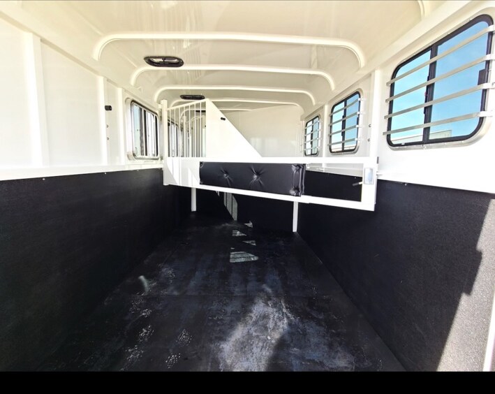 Stall dividers and padded interior walls inside the actual trailer